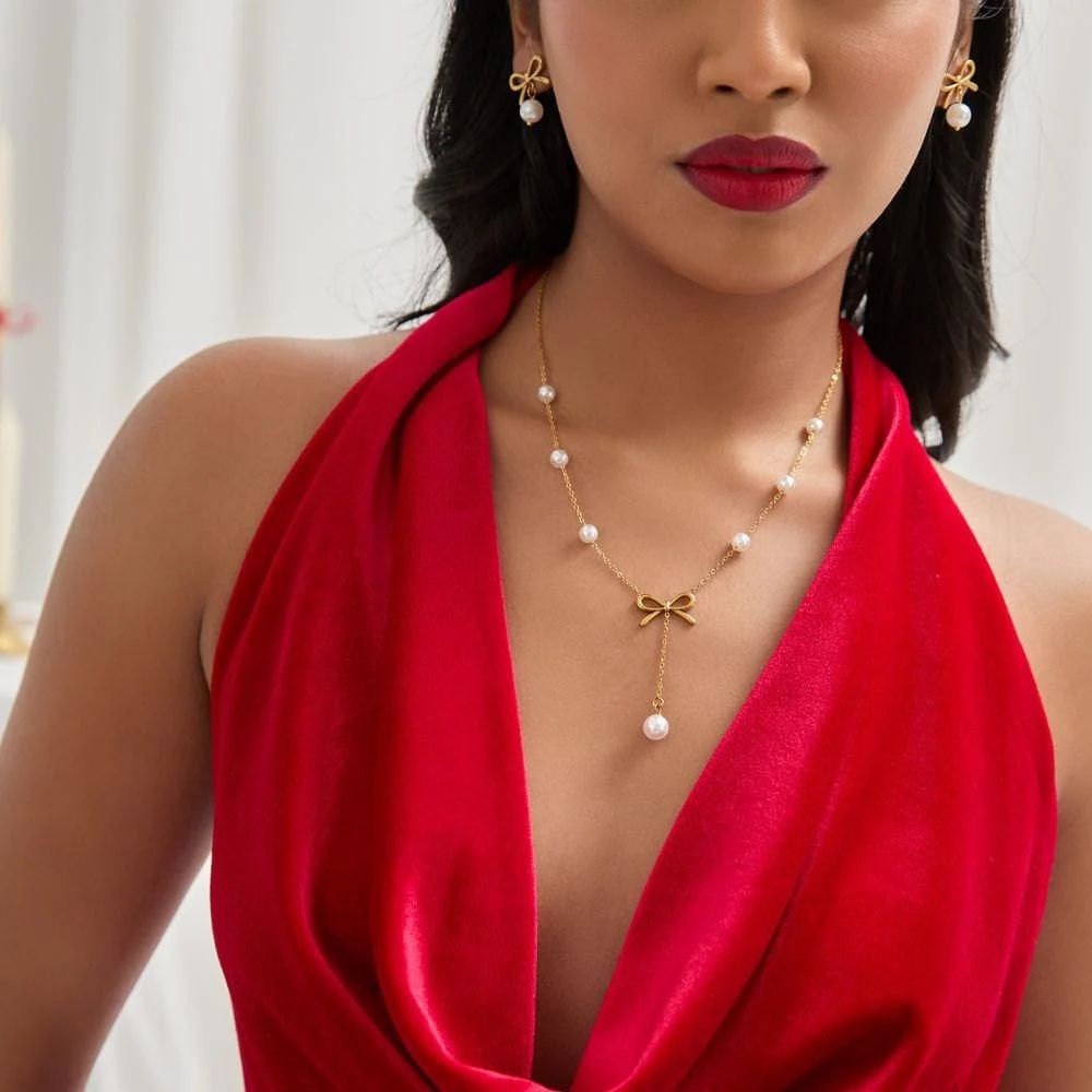 Bow pearl drop necklace