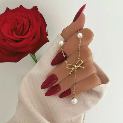 Bow pearl drop necklace
